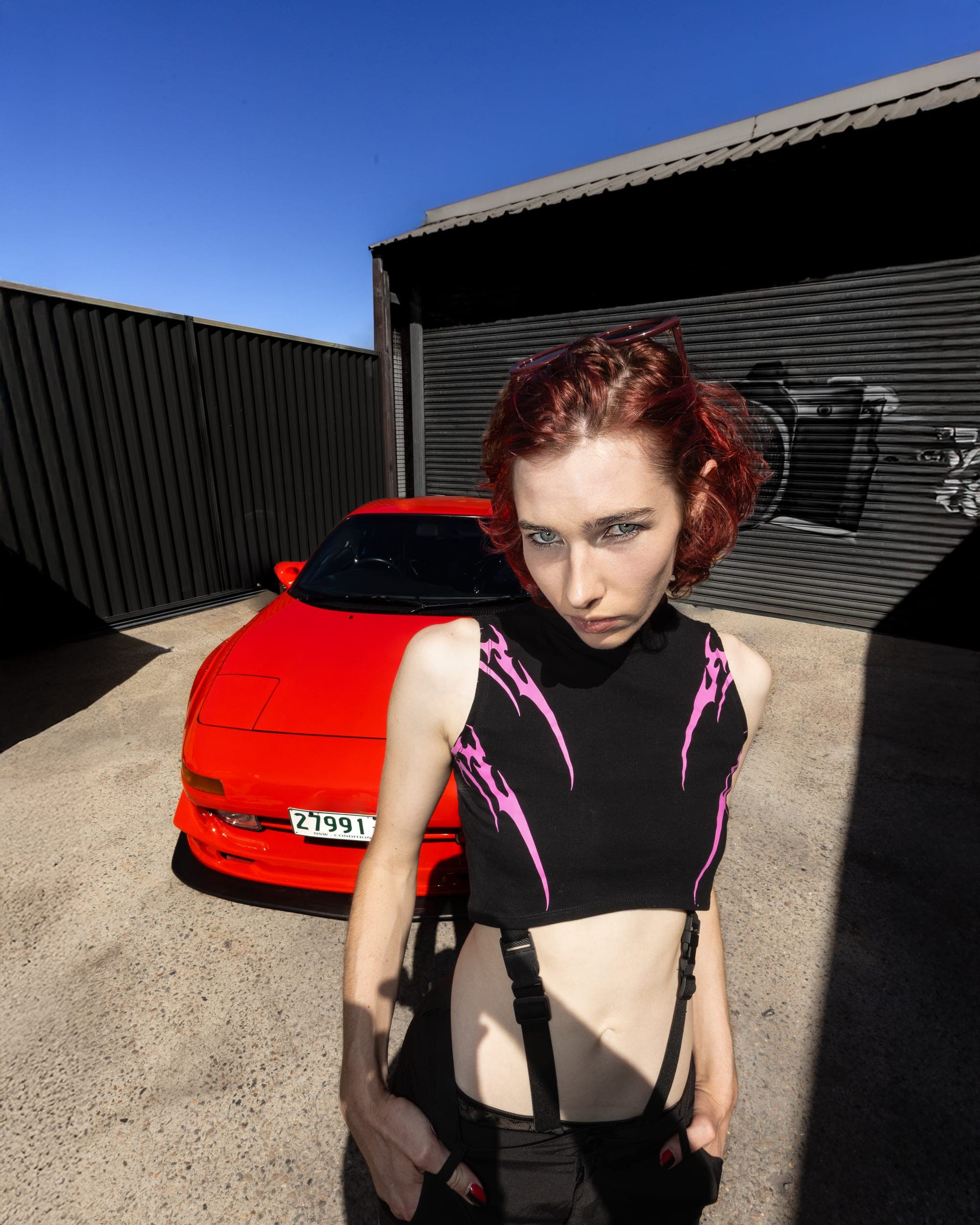 Model in a black and white patterned suit outside the Museum of Contemporary Art, Sydney street fashion